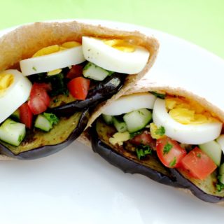 Sabich eggplant sandwich stuffed into a pita